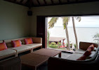 Resort sitting area overlooking tropical greenery